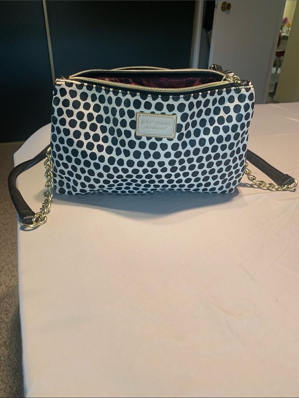 The Sak Black and White Polka Dot Chain Strap Crossbody with Gold Accents